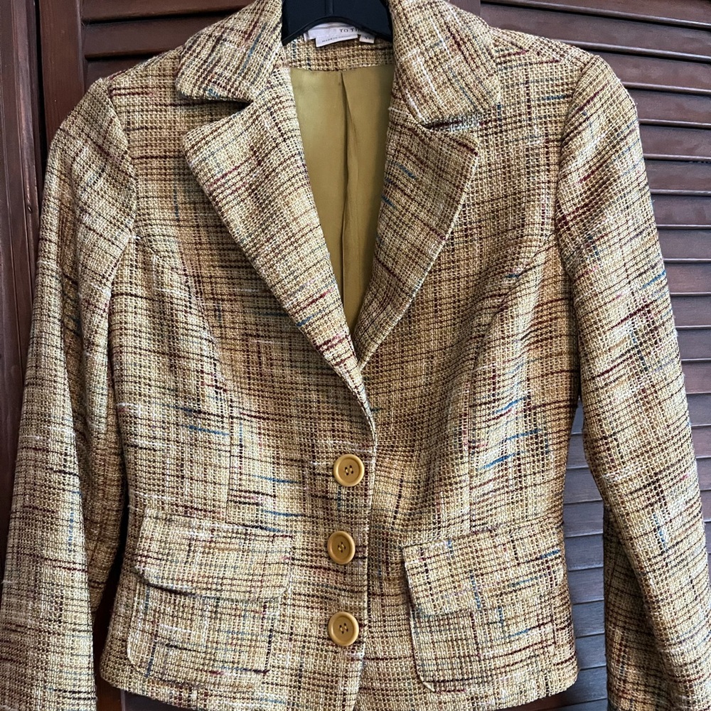 Multi-colored jacket. The base is pale yellow with multi-colors stripes. Size XS